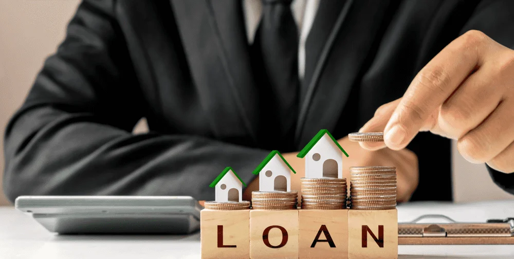 model-house-pile-coins-businessman-holding-coins-real-estate-investment-ideas-home-loans-new-home-loans-lowinterest-rates-homes-1-1-1.webp